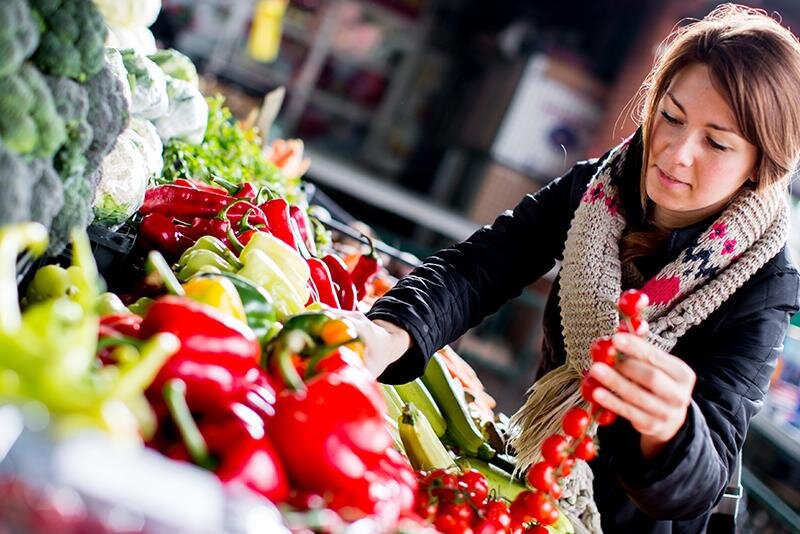 Lady purchasing a vegetable